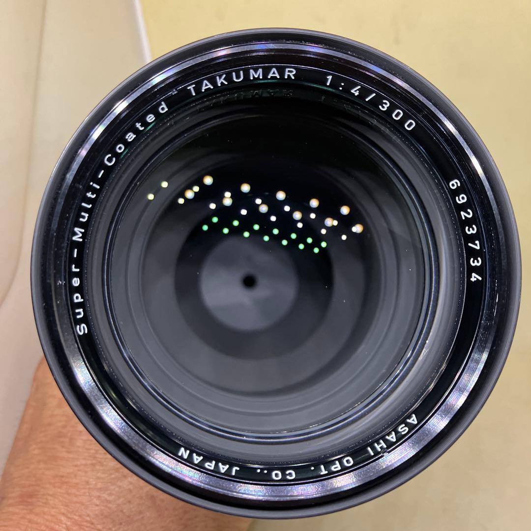 Super-Mult-Coated TAKUMAR 300mm F4になります。