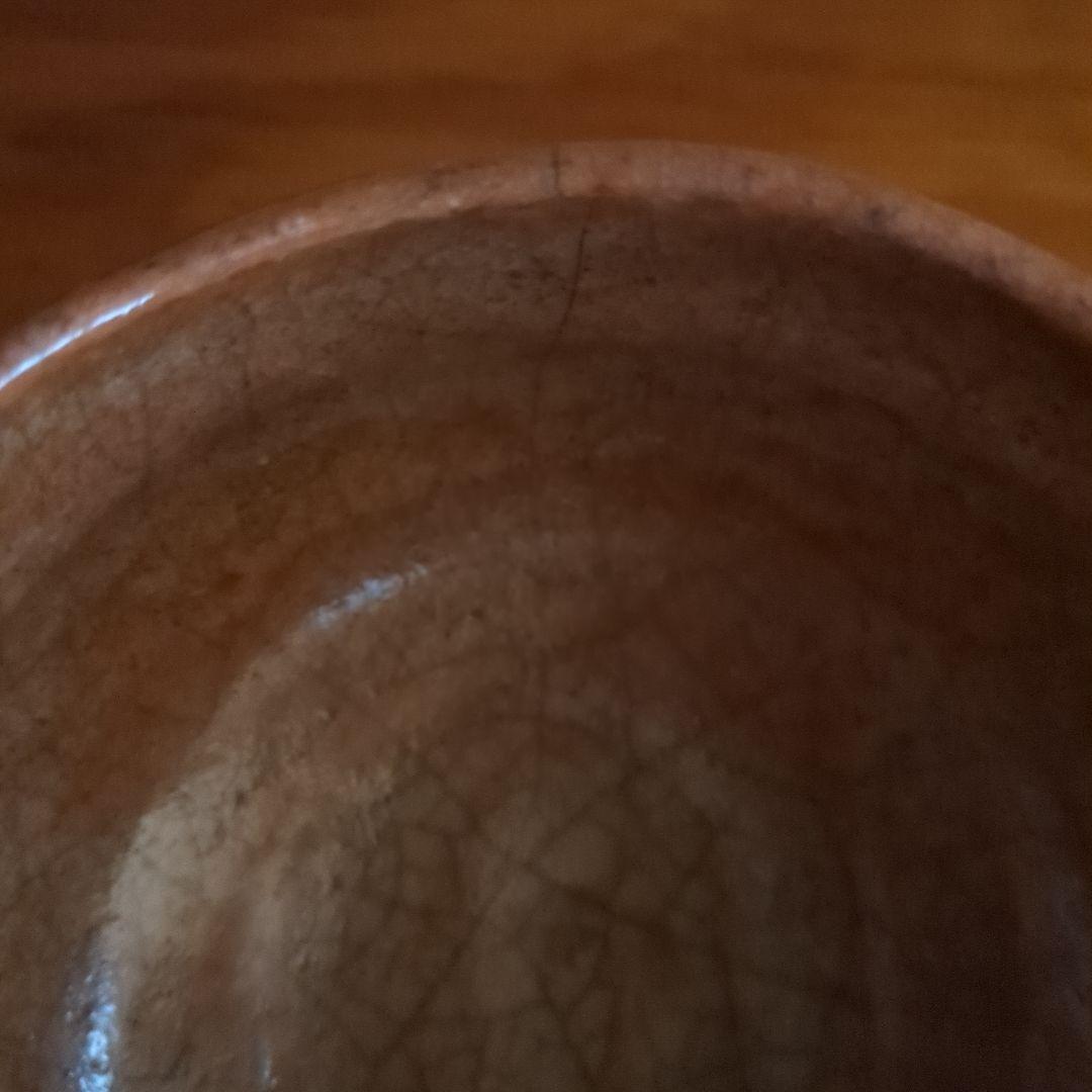 オレンジ色の陶器の茶碗　初代中村道年作赤楽茶碗