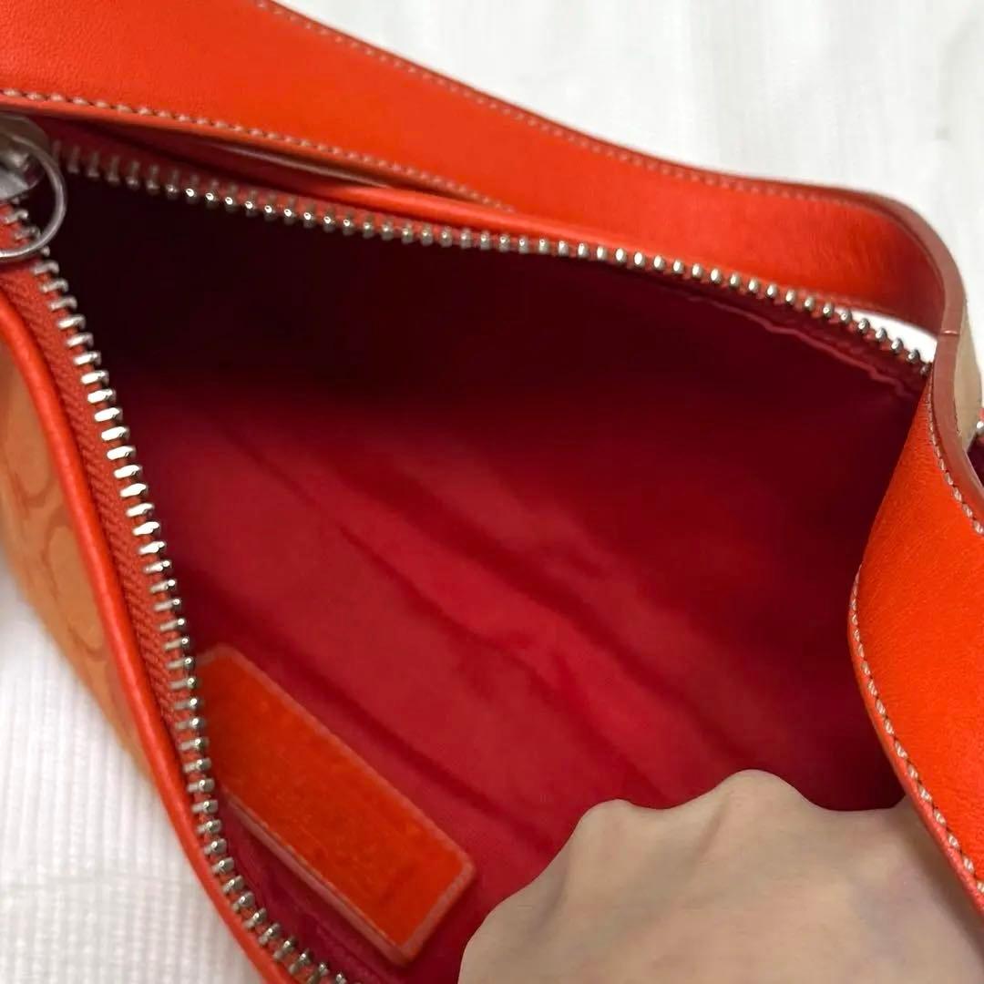 COACH アクセサリーポーチ　ワンショルダー　シグネチャー　オレンジ