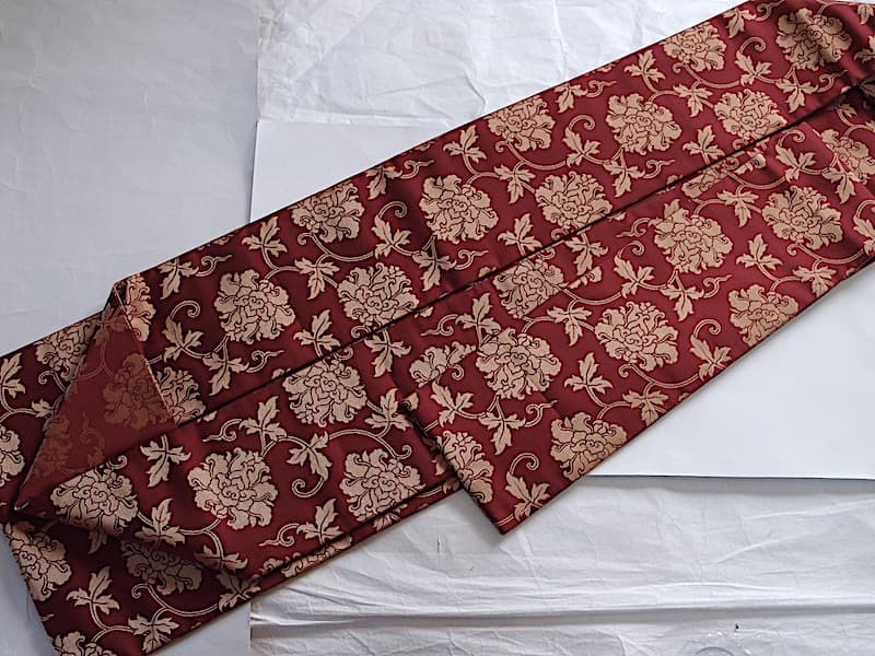 織りの九寸名古屋帯（牡丹唐草文）正絹美品